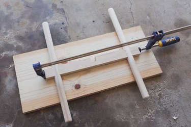 Apply wood glue and clamp the pieces together while dryingApply wood glue in all joints and firmly clamp in place. I used scrap pieces to help the clamps get a grip on the legs. Wipe away any excess glue and let dry overnight.
