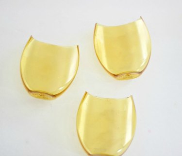 Three shaped vessels.