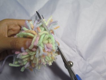 Trimming the yarn.