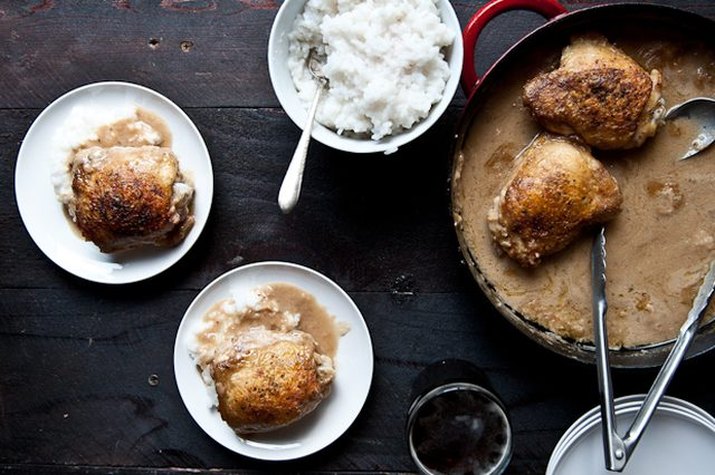 Plates of cream parmesan mustard brown ale skillet chicken served with rice.